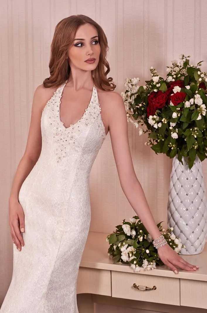 ---Elegant mermaid wedding dress with halter neckline made in lace decorated with embroidery, beads and sequins on the neckline-