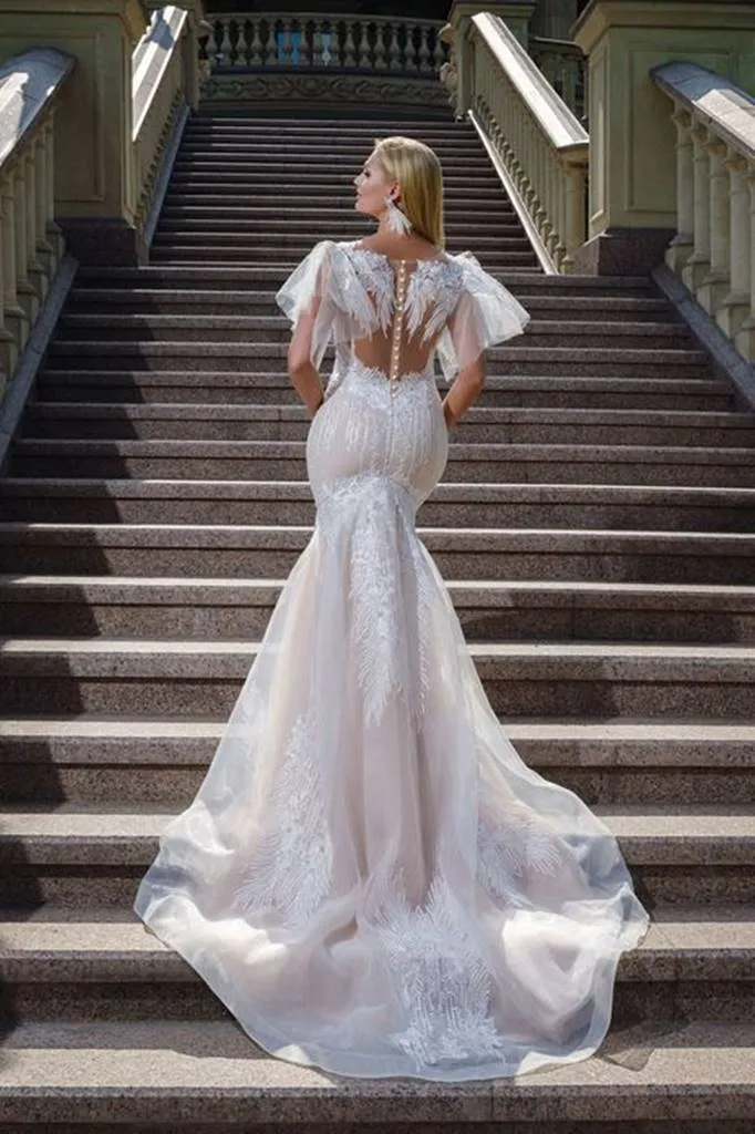 ---Sexy curvy wedding dress, a mermaid model in lace with transparencies, impressive pronounced neckline topped with straps--